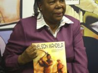 Education Minister Naledi Pandor with a Nelson Mandela biographical comic  book