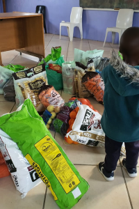 A child, with food parcels at an E1F1 event