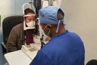 Dr Tebogo Maleka checks Mabel Maleka's (no relation) eyes ahead of operating to restore her eyesight 2
