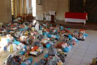 Piles of food parcels at an E1 F1 food distribution at Bodibe