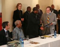 Arts and Culture Minister Pallo Jordan accepts Rivonia Trial documents from Nicky Oppenheimer