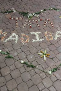 "Madiba" written in chalk on paving stones
