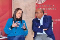Ferial Haffejee and Mo Ibrahim discussing a point at Young Women in Dialogue