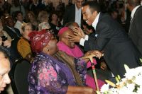 Dr David Molapo embraces Archbishop Tutu and his wife, Leah Tutu 2