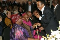 Dr David Molapo embraces Archbishop Tutu and his wife, Leah Tutu 3