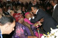 Dr David Molapo embraces Archbishop Tutu and his wife, Leah Tutu