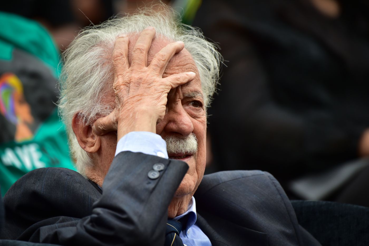 George Bizos clasps his forehead at a memorial service for Winnie Madikizela-Mandela