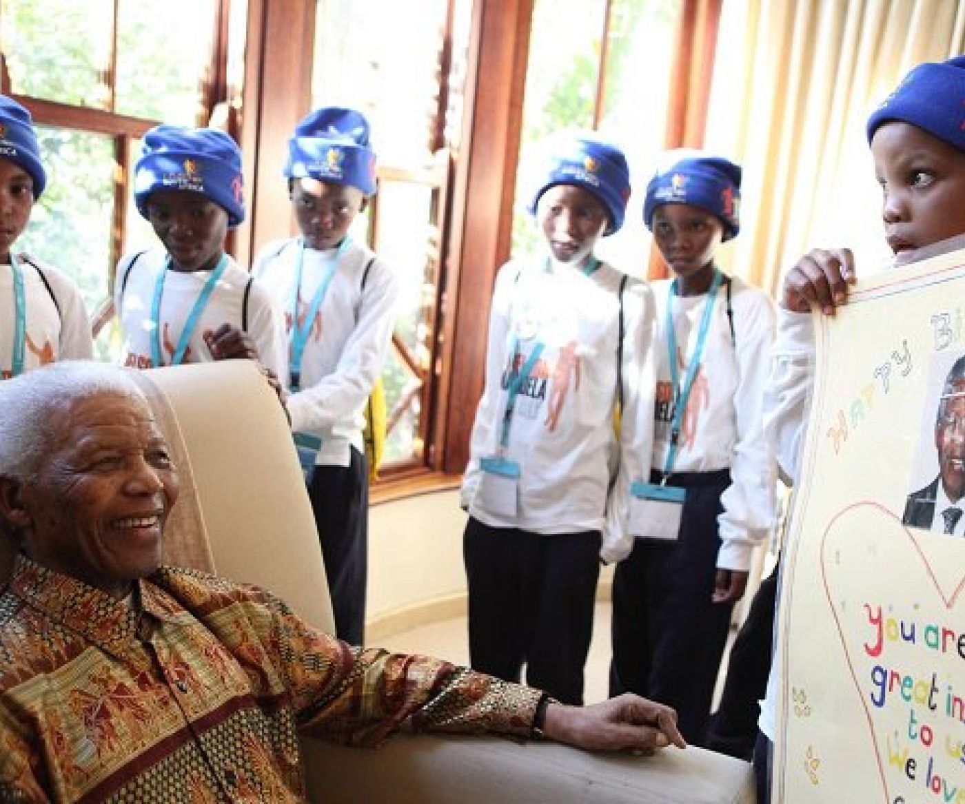 Children with Mandela on Mandela Day